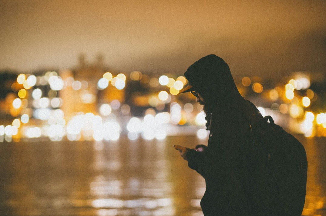 person checking phone at night