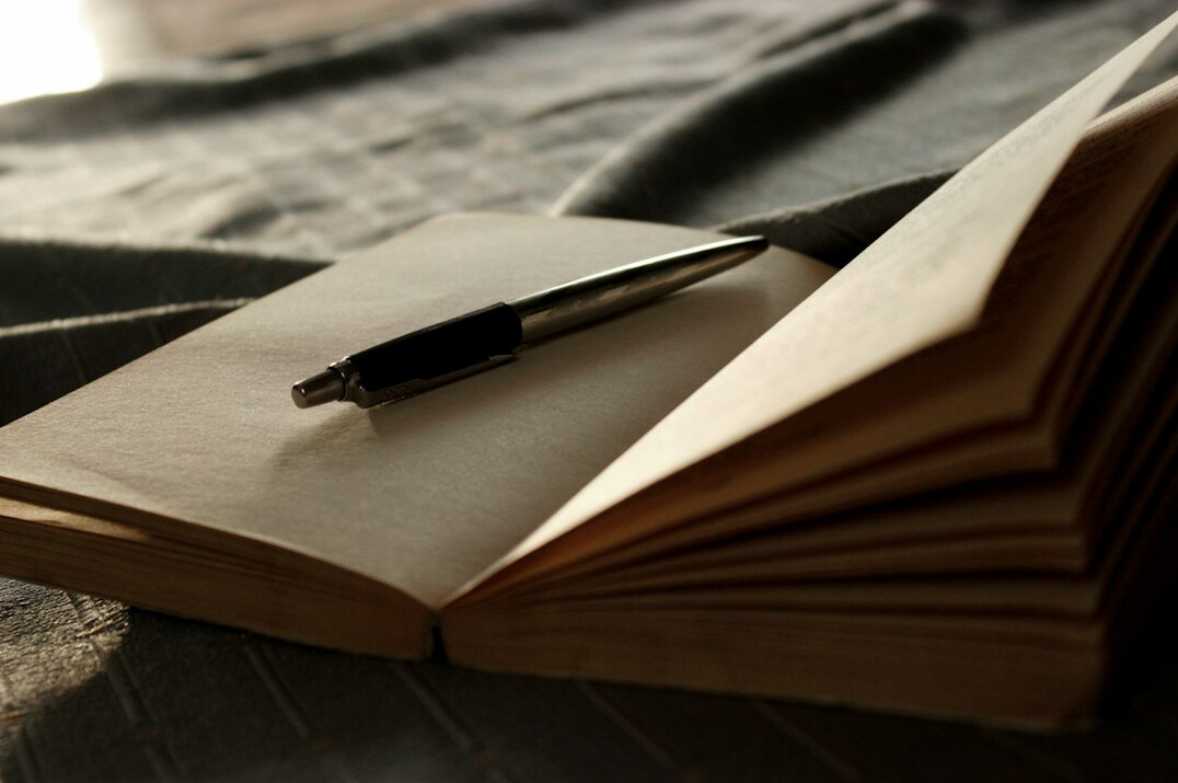 detective notebook and pen